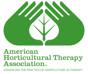A pair of illustrated green hands forming a leaf shape in the negative space in center above green text reading American Horticulutral Therapy Association Advancing the practice of Horticulture as therapy.