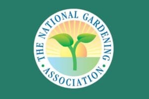 The National Gardening Association in a circle of blue text framing a sprouting seedling in front of a brilliant shining sun.